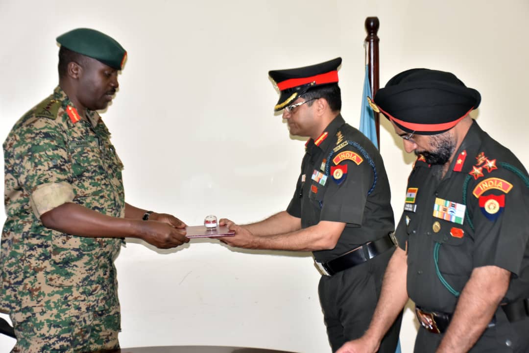 UPDF CDF, Gen David Muhoozi awards the Indian Military trainers. (PHOTO Defence Press Unit)