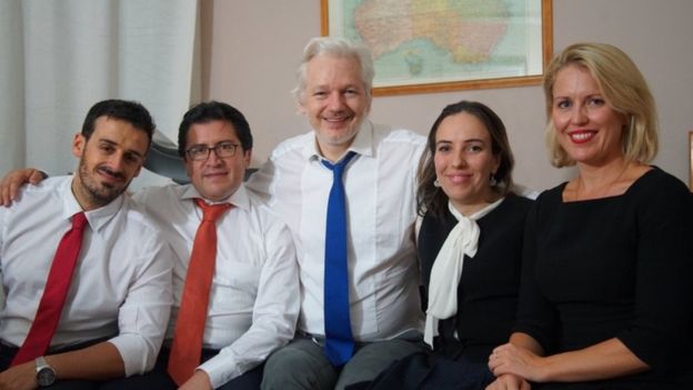 An undated photo issued by Wikileaks shows Julian Assange (c) with his partner Stella Morris (second right) alongside other members of his legal team
