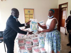 Hon.Meddie Mulumba Hands Over Food FRelief to Luuuka RDC Pamela Watuwa (1)