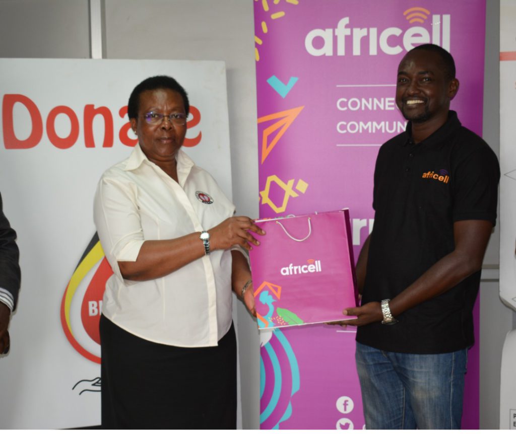 Left_To_Right_Dr Dorothy Nakyeyune UBTS ED receives Donation_From Africell PRO Edgar Karamagi