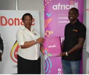Left_To_Right_Dr Dorothy Nakyeyune UBTS ED receives Donation_From Africell PRO Edgar Karamagi