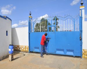 MP Odria while locking the Arua quarantine centre (The gate of Arua Core PTC). COURTESY PHOTO