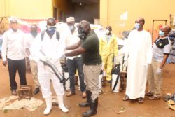 Hared's Yufusu Ali and Muhammad hands over Disinfectants to Jinja Task Force in the Market 3
