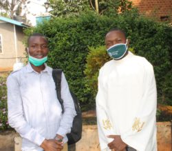 Redpepper's Brian Musaasizi with Father Joe King at St.Karoli Lwanga-Mbikko - Copy