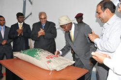 Abid Alam (L) Inspecting one of his Factories with President Museveni (2)
