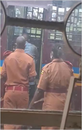 Minister Rukutana boarding Prison Bus after being Charged with 7 counts at court. photo