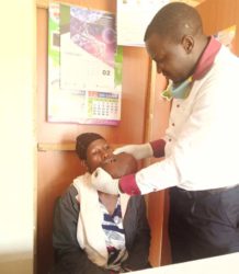Dr.Obaala Antony , also Director Smile Afresh Examins the Victim (1)