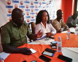 Eng. Aita stresses a point as (L-R) Celia, Clark and Sunday Etrima, the DI CEO look on during the press briefing