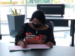 H.E Jewel Howard Taylor signing in the visitor's book after commissioning the JOADAH Consults headquarters on Tuesday