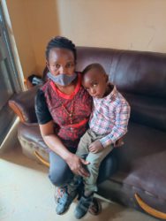 Mary Tumukwese with her son