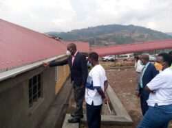 State minister of finance (general Duties) Henry Musasizi assesses the defects on building