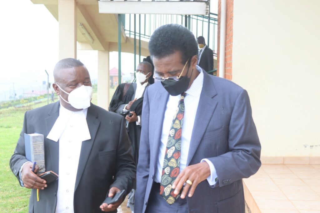 Maj Gen. Jim Muhwezi leaves kabalwe high court with his lawyer Mwesigwa Rukutana on friday