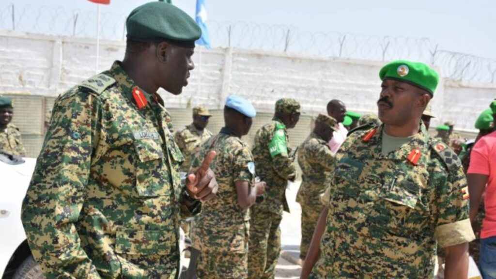 Deceased-Gen-Paul-Lokech-left-is-seen-talking-to-Gen-Kayanja-Muhanga