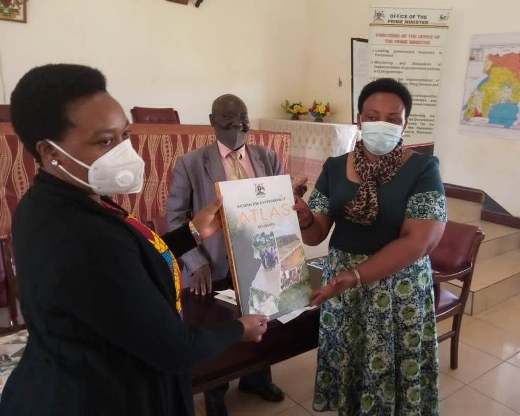 The Disaster Preparedness Officer in the Office of the Prime Minister Catherine Ahimbisibwe (L) Launch the atlas