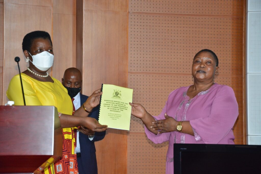 Outgoing Presidency Minister Esther Mbayo(L) hands over to incoming Minister Milly Babalanda