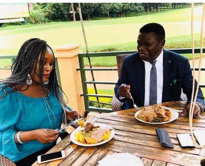 Mao and Kayanja enjoying a meal