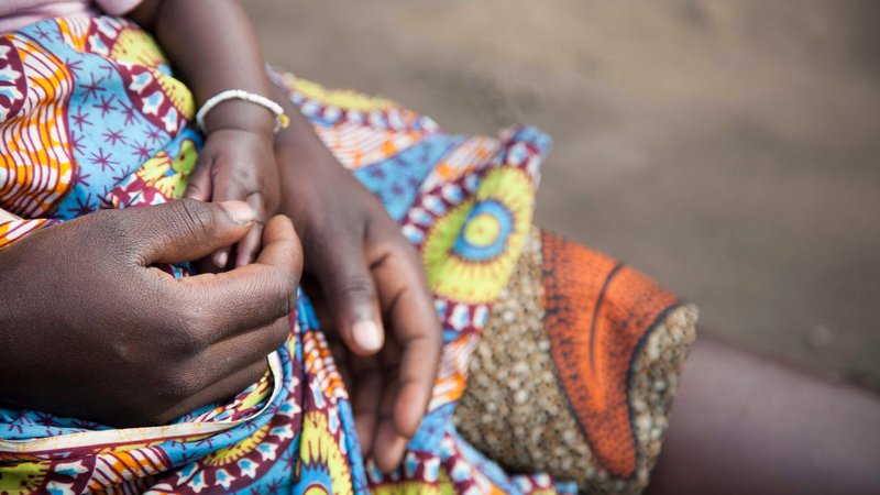 A-young-Ugandan-mother-sits-with-h.2e16d0ba.fill-800x450-1