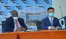 CAA DG Fred Bamwesigye (L) and Zheng Biao, Country Manager CCCC pictured together recently.Photo by Julius Bamwesigye