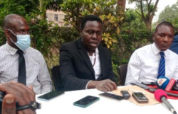 Herbalist David SSenfuka (Center) at a press conference on monday