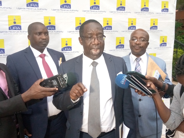 Dr. Keefa Kiwanuka, the Chairperson of the Finance Planning and economic developement speaking to Journalists after the meeting on Monday