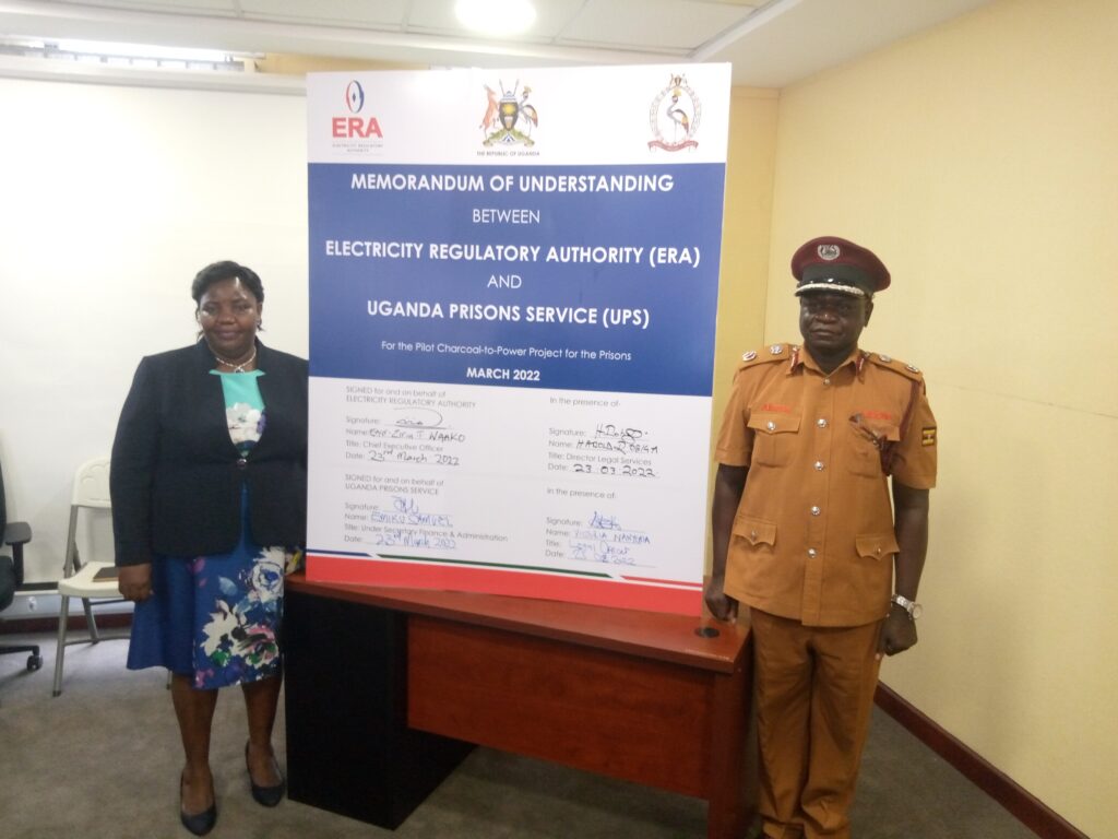 Eng. Ziria. T Waako (R) ERA ED and Asst. Commissioner General of Prisons Akena Samuel (Right) in a photo moment after signing the agreement on Wednesday, 23 March, 2022