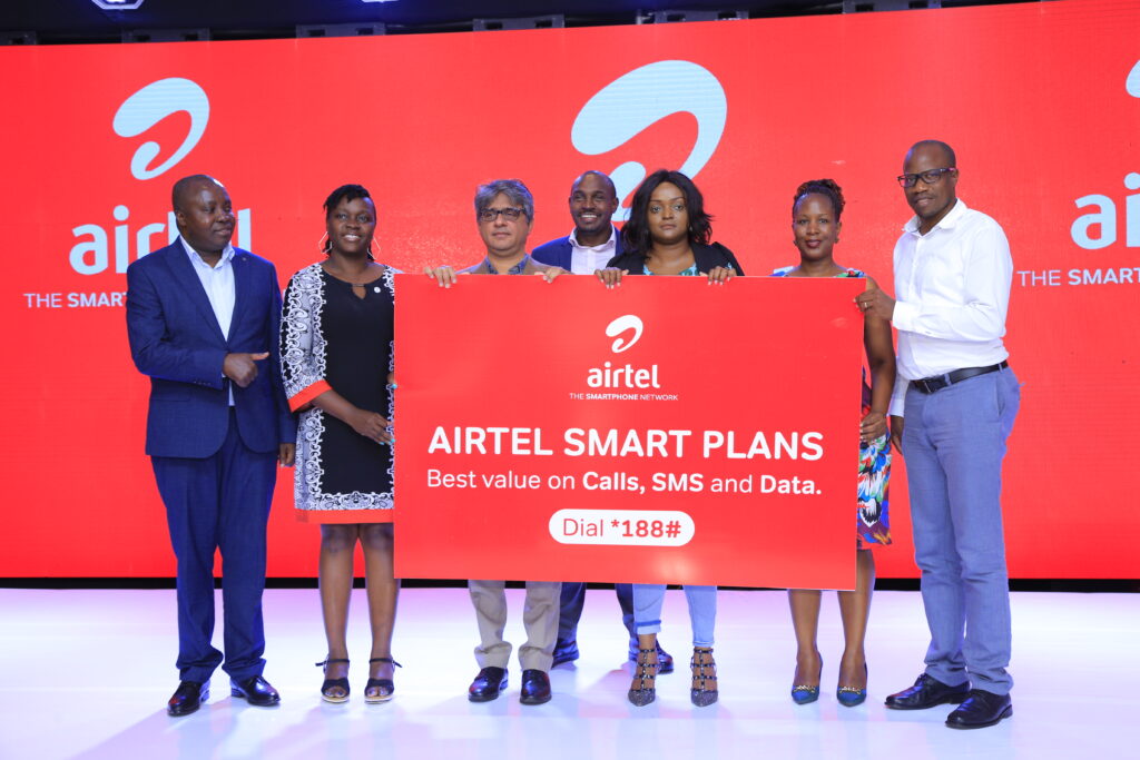 Amit Kapur (3rd L), Chief Commercial Officer Airtel Uganda, Henry Njoroge,(C), Marketing Director Airtel Uganda, Daphine Kemuto (3rd R) Trade Marketing Executive Multichoice Uganda during the launch on Wednesday.