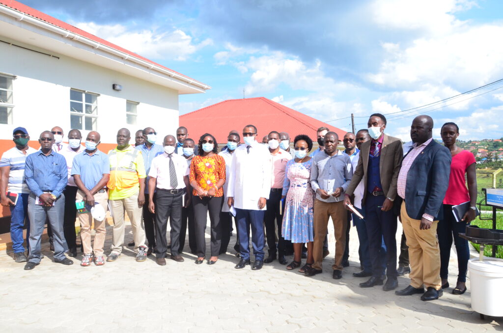 Dr Celestine Barigye leading guests from world bank, MOH and other Hospital Staff for a group photo