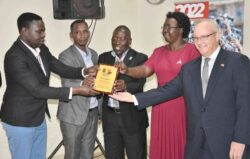Dr.Ssenfuka Recieves an award from UJA officials and the guests