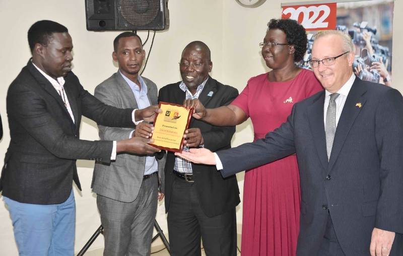 Dr.Ssenfuka Recieves an award from UJA officials and the guests