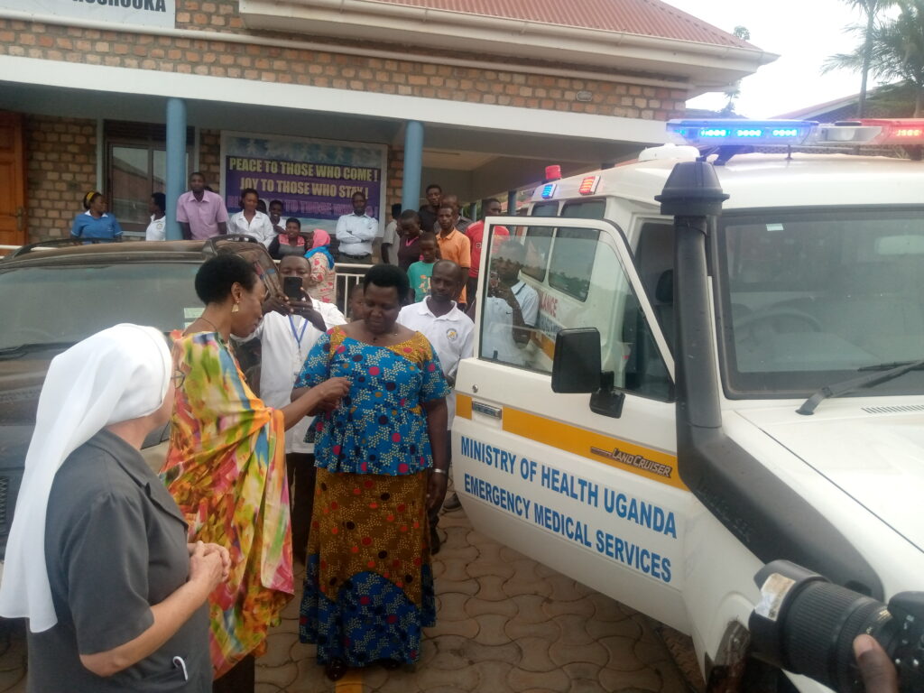 Hon. Naome Kabasharira handing over the Ambulance Keys to the ADHO Ntungamo and and Sir Marlene the In-charge