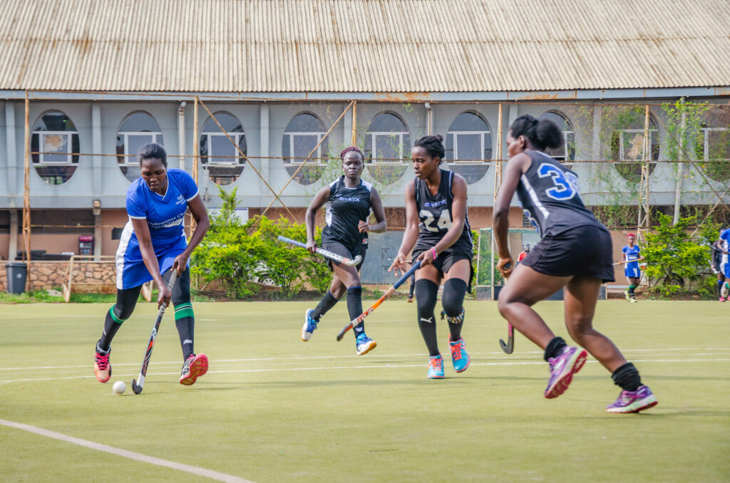 Sharon Oroma (left) in action for DCU against Wananchi during the inaugural Memorial Shield at Lugogo.
