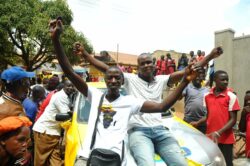 Wasswa (In jeans) celebrates his win with friends