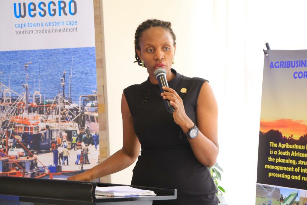 Immaculate Blessing Owomugisha the acting Secretary General of UNCCI, speaking at the business summit