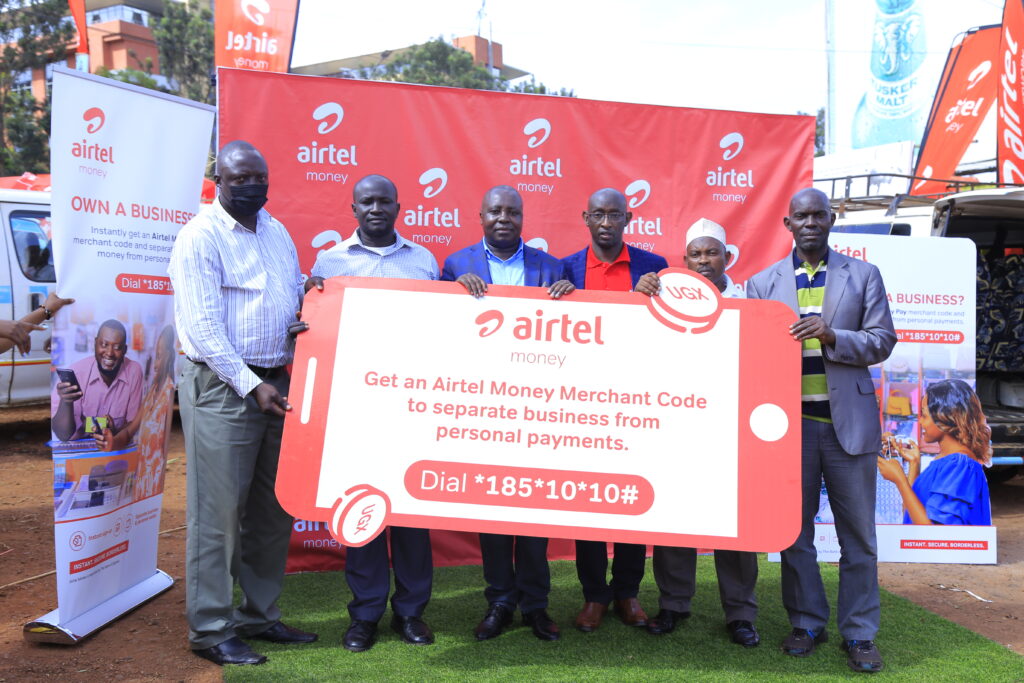 Mr. Japhet Aritho (3rd L), the Managing Director Airtel Mobile Commerce Limited (AMCUL), David Birungi (3rd R), Public Relations Manager at Airtel Uganda with Leaders of Nakawa Market. Courtesy photo