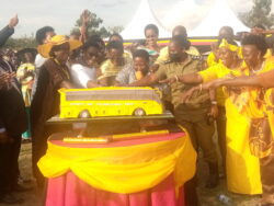 PM Nabanja acompanied by fellow MPs during the cutting of the cake at Bwizibwera play grounds