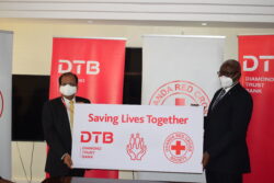Varghese Thambi (L) MD DTB Bank and URCS SG Robert Kwesiga (R) displaying the dummy showing their partnership in the drive