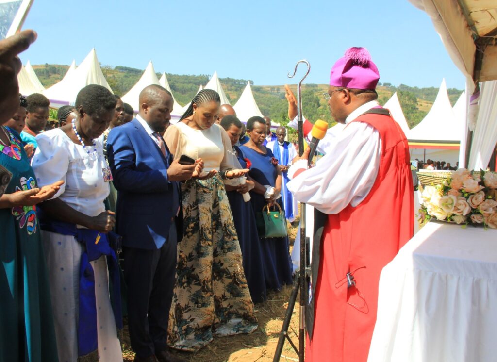 Bishop Akanjuna blesses MP Ndyomugyenyi at the thanks giving