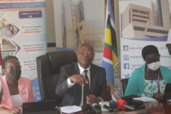 UBOS Executive Director Chris Mukiza (middle) stressin a point during the interview on Wednesday
