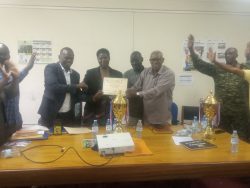District Chairman handing over certificate to BSU Staff