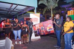 Onapito and some of the NBL staff during the Global Beer Responsible Day at the Levers Bar in Kamwokya on Friday