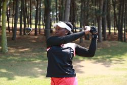 Peace Kabasweka watches the progress of her ball at Entebbe Golf Club.