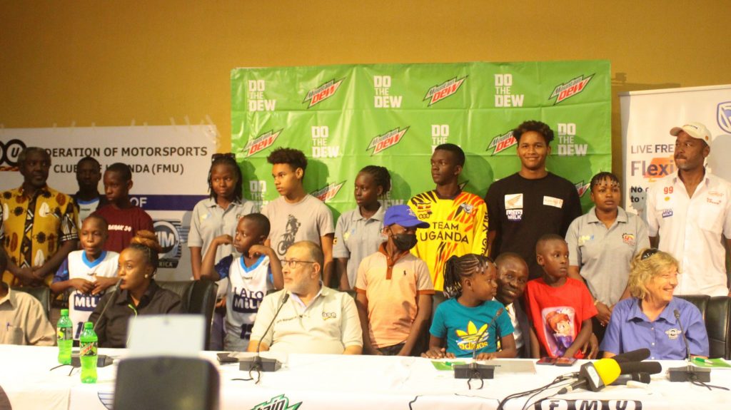 Some of the riders, sponsor representatives, organizers and other delegates pose for a photo on Wednesday
