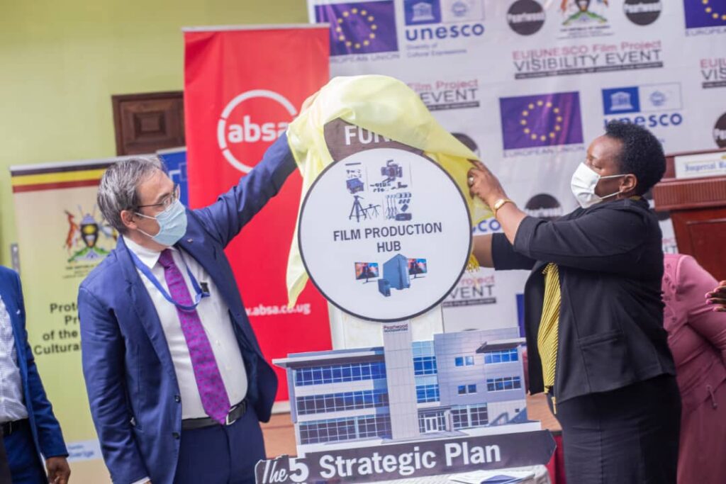 Minister Peace Mutuzo alongside a UNESCO official, unveiling the 5-year strategic film plan