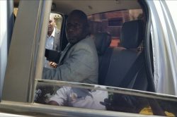 Paul Walakira aboard IGG vehicle upon his arrest on Friday