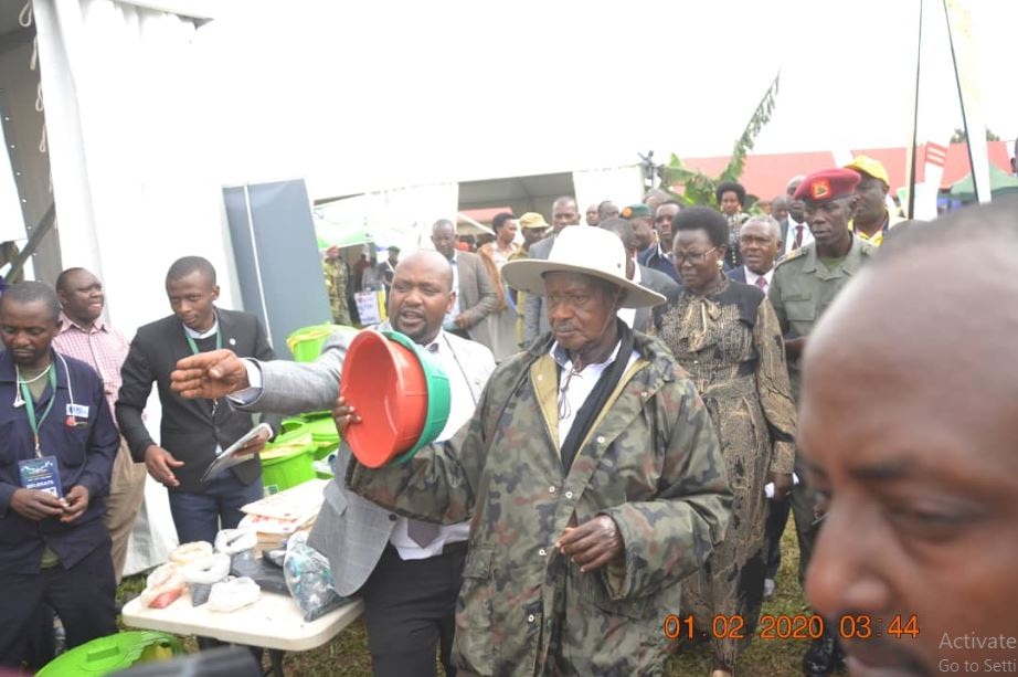 UPMRA Director Moses Ategeka taking through the president on how recycling 'kaveera' breeds new plastic products