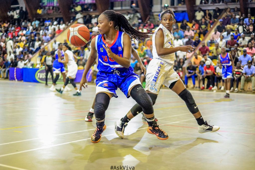 Action between UCU Lady Canons (blue) and JKL Lady Dolphins on Friday evening.