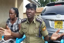 Anguyo stressed a point as Brenda Jurua (L), also a police officer looked on during the media briefing on Thursday. PHOTO BY ANDREW COHEN AMVESI