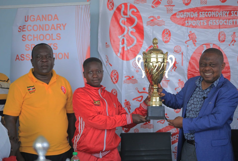 Bombo Umea captain present Girls football trophy to USSSA President