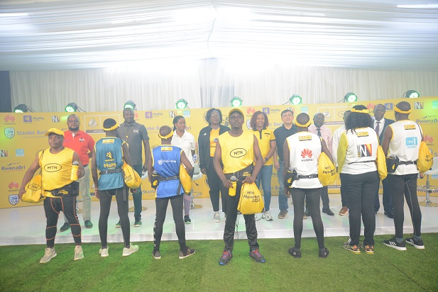In-the-back-row-are-the-representatives-of-the-MTN-Kampala-Marathon-Partners-and-in-the-front-row-is-the-display-of-the-2022-MTN-Kampala-Marathon-kits