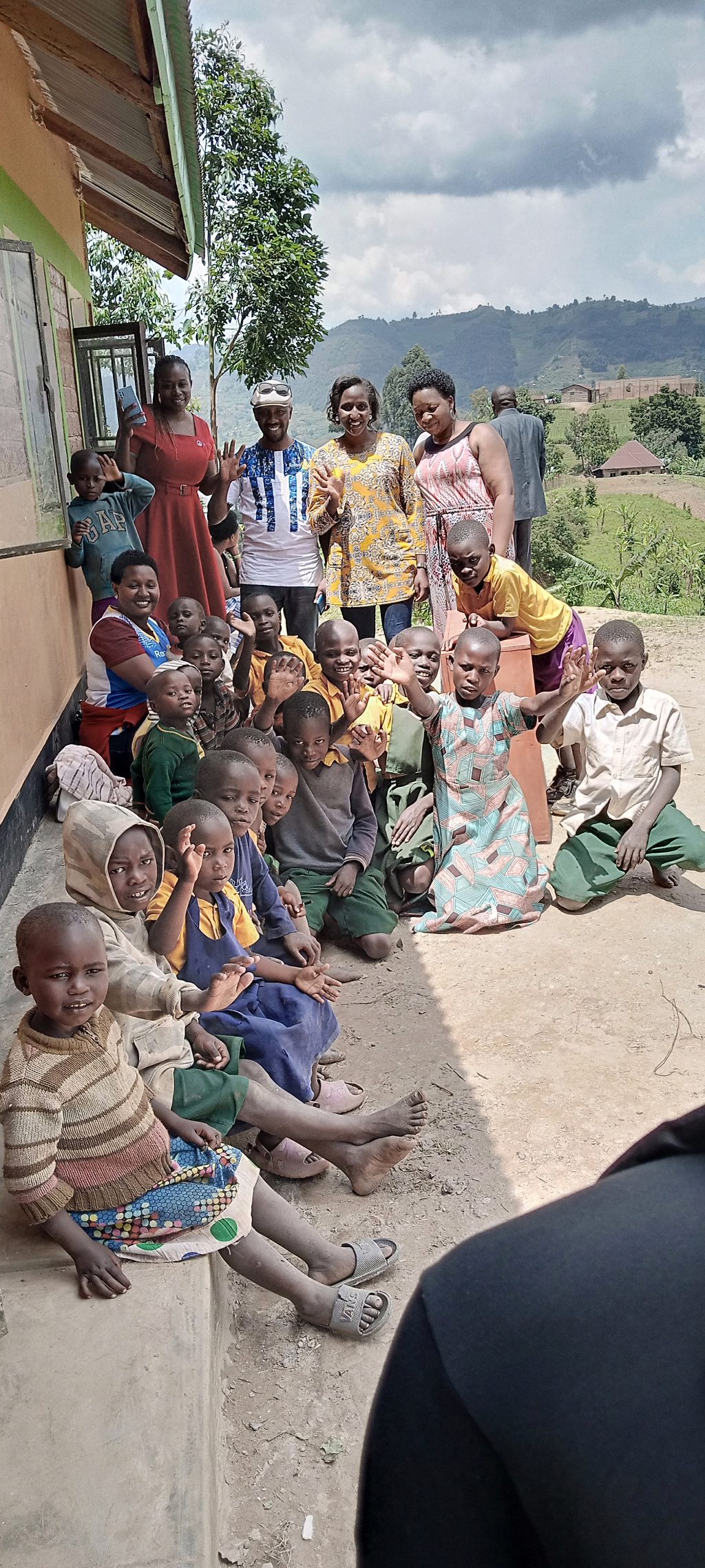 The Rotarians in a group photo with the staff and pupils of Muhanga School